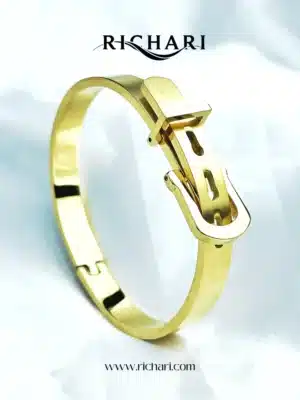 “Buckle-Inspired Golden Bangle by Richari”